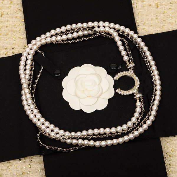 Luxurious diamond-accented sweater chain pendant necklace featuring natural shell beads on genuine black leather with stamped gift box PS3020B