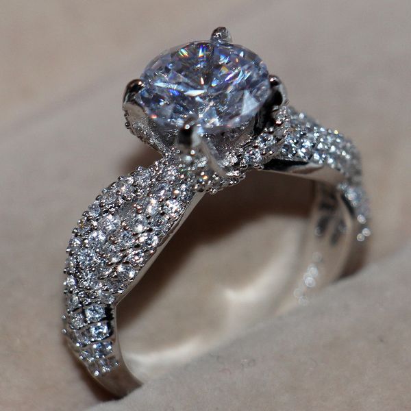 Luxurious dinosaur claw ring set with diamonds in 14kt white gold, ideal for women's engagement and wedding bands