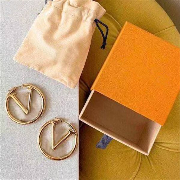 Luxurious gold circular letter earrings for women, a vintage-inspired designer fashion statement with large metal ring studs
