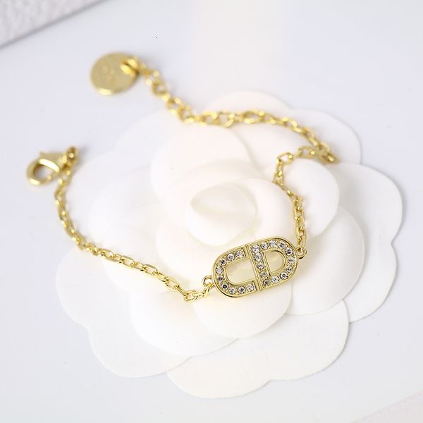 Luxurious gold-tone bracelet with sparkling diamonds, a trendy choice for women