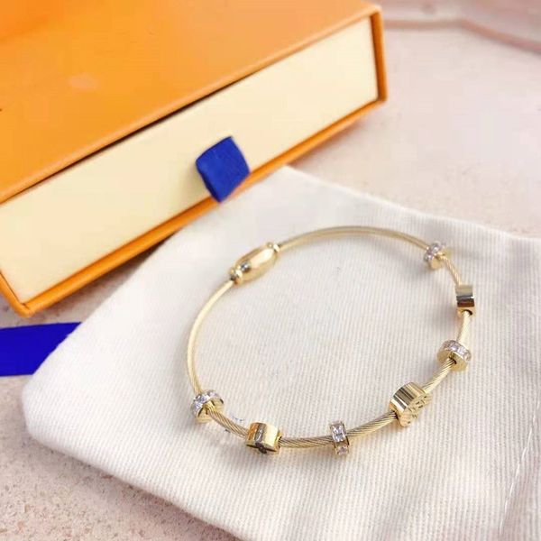 Luxurious hip hop bangle jewelry in 316L stainless steel, available in silver, gold, rose, and black with letter designs for men and women