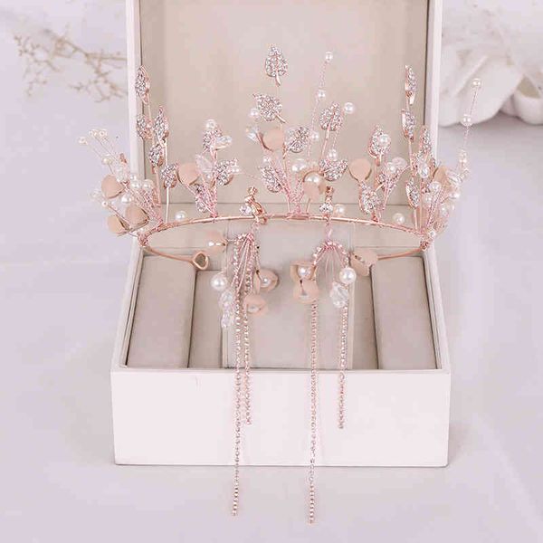 Luxurious pearl and diamond bridal crown and earring set for 2021 weddings