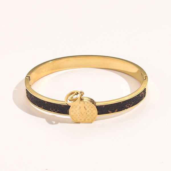Luxurious women's bracelets featuring designer letter jewelry in 18K gold-plated stainless steel, stylish cuff wristbands for fashionable accessorizing