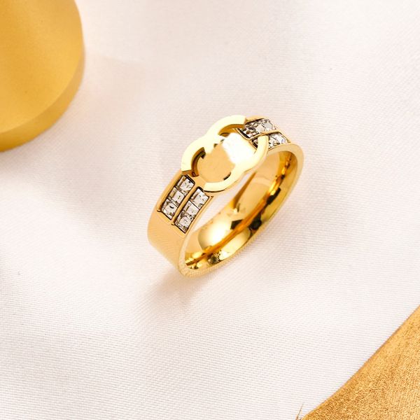 Luxurious women's designer rings featuring charms, wedding styles, 18K gold plating, stainless steel, fine detailing, and rhinestone accents
