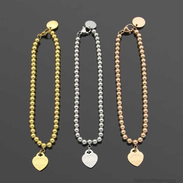 Luxury beaded designer bracelet set with classic heart charm in 18K gold, a perfect Valentine's Day love gift for women in stainless steel