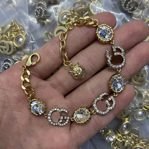Luxury designer bangle bracelet with 18K gold, crystals, pearls for stylish women's wristwear and couple gifts