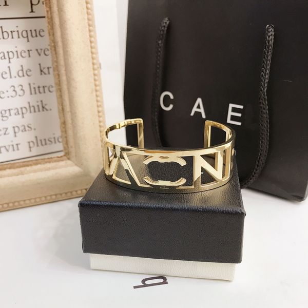 Luxury designer bangle bracelet with letter P pendant in 18K gold plated rose gold finish, featuring embossed brand stamp for a fashionable look