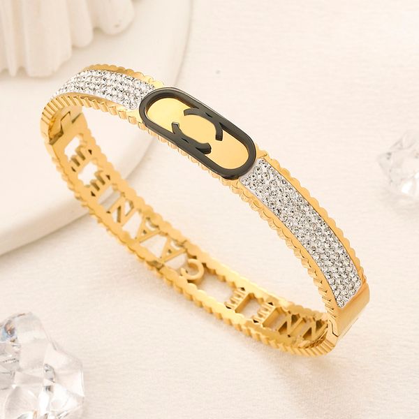 Luxury designer bangle in 18K gold-plated stainless steel with diamond accents for stylish women and men
