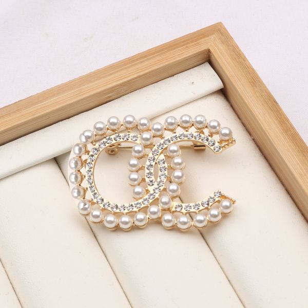 Luxury designer brooch with 18K gold plating, crystal rhinestones, and letter charm for elegant women and men, perfect for weddings and Christmas