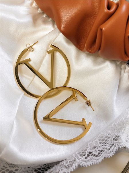 Luxury designer gold hoop earrings for women, perfect for parties, weddings, and bridal jewelry gifts