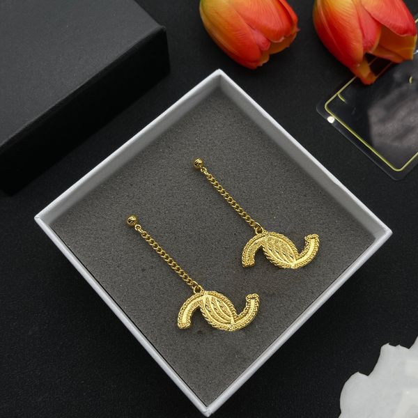 Luxury designer gold stud earrings for women featuring the CCity brand letter C