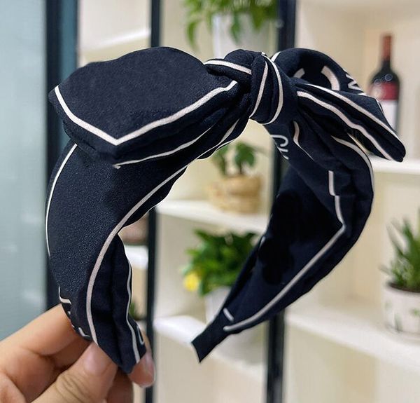 Luxury designer headbands for women featuring letter prints, wide edges, and cross-knotted styles as fashionable hair accessories