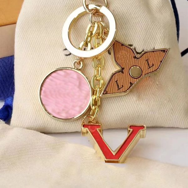 Luxury designer keychain featuring classic brand letter design with gold L buckle, handmade for men and women's bags