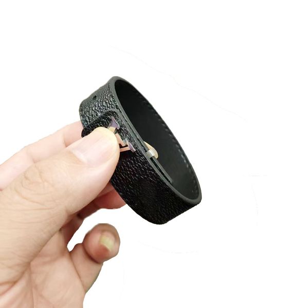 Luxury designer leather bracelets for men and women, featuring punk and hip-hop styles with titanium steel accents, presented in elegant gift box packaging