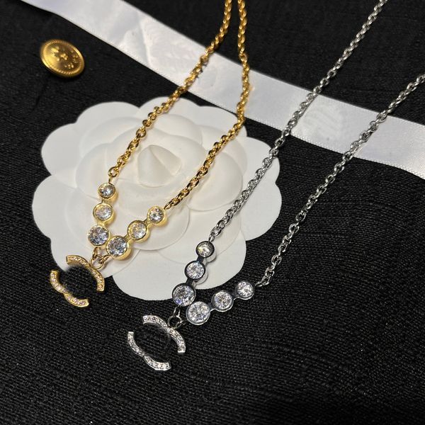Luxury designer pendant necklace featuring diamond-like zircon stones on an 18K gold-plated stainless steel choker chain with letter charms for women