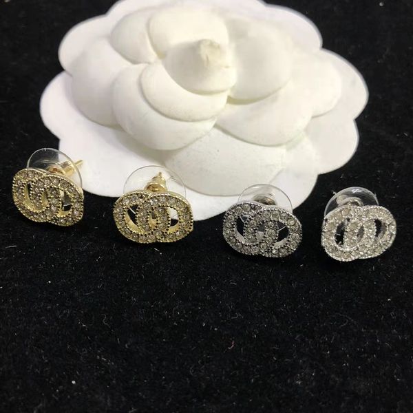 Luxury designer stud earrings featuring two-letter diamonds, a stylish and elegant women's fashion jewelry piece, presented in a high-quality box as a perfect gift