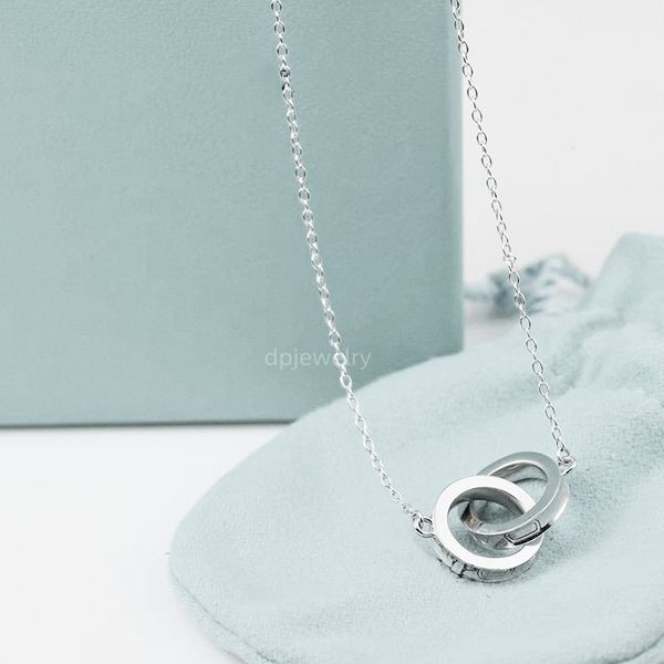 Luxury double heart necklace for women, featuring a stainless steel heart-shaped pendant with diamond accents, a stylish designer jewelry piece perfect as a Christmas gift or elegant accessory