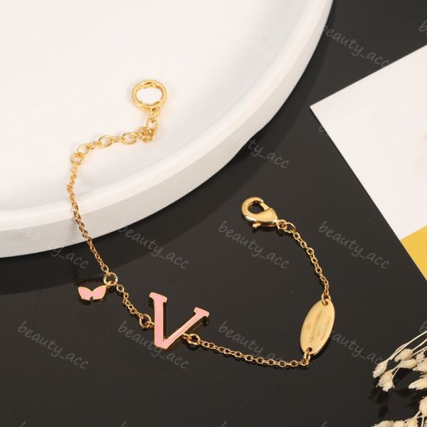 Luxury gold chain designer bracelets for men and women with floral charms and lettered box packaging
