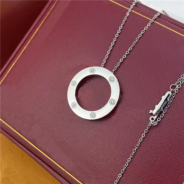 Luxury gold necklaces for women and men, featuring designer titanium steel circle pendants, snake chains, and diamond accents for anniversary gifts