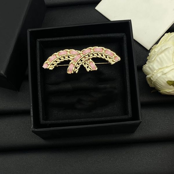Luxury gold-plated designer brooch with pearl and diamond accents, perfect for weddings, parties, or as a stylish couple's gift