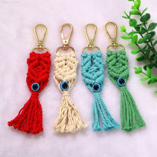 Luxury new metal ring buckle with colorful cotton strip, handwoven eye pattern tassel keychain, creative and stylish