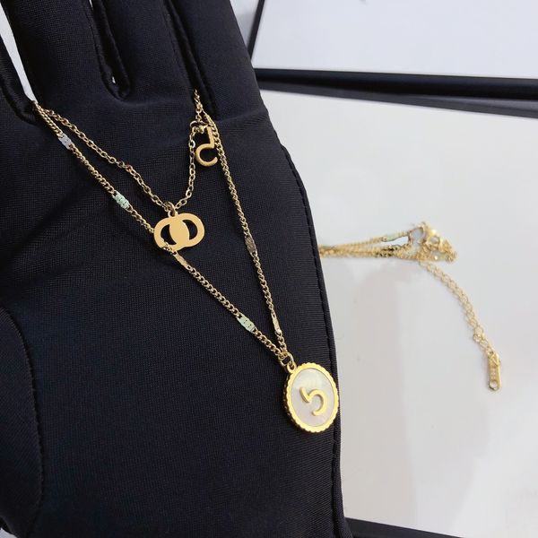 Luxury pendant necklaces featuring a classic double-layer design, high-end women's fashion jewelry with elegant long chains