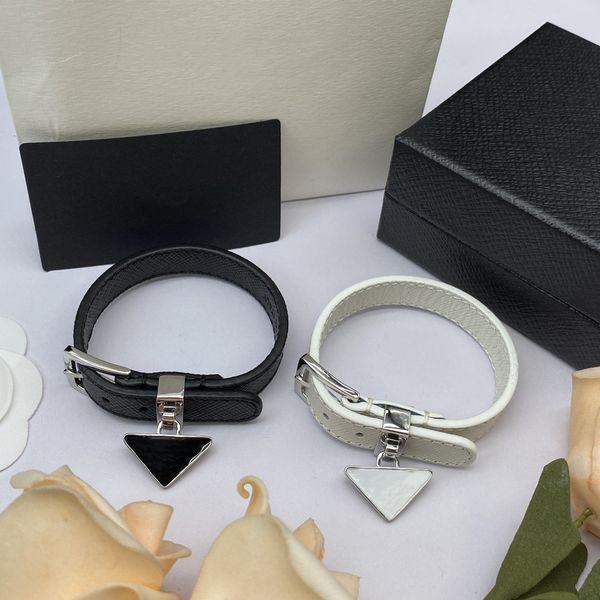 Luxury unisex white and black belt bracelet with adjustable triangle design, perfect for rock, hip hop, youth, commuting, and parties