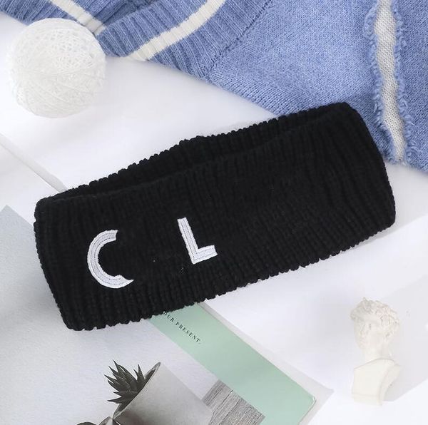 Luxury women's winter headbands with designer fur and printed brand lettering, stylish wide hair accessories for face washing