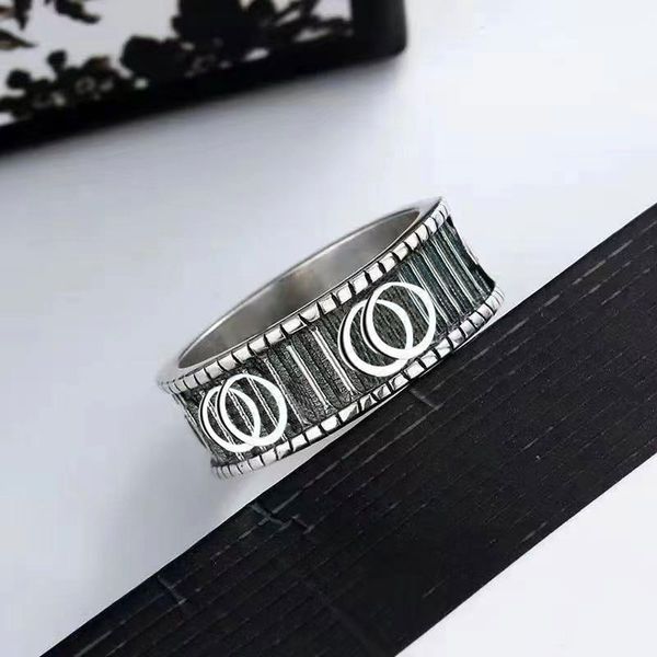 Man and woman couple rings with engraved letters in silver, gold, and stainless steel jewelry