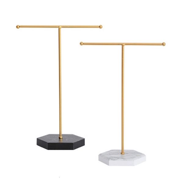 Marbled T-shaped metal jewelry stand with hexagonal base for displaying necklaces, bracelets, and earrings