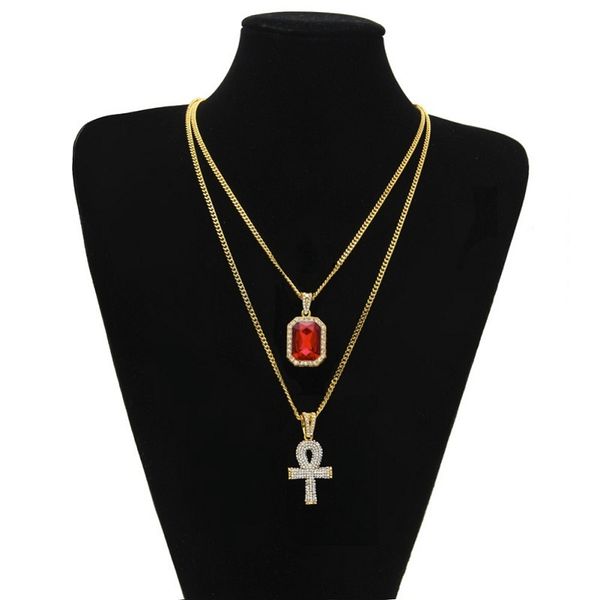 Mens hip hop jewelry set featuring a gold chain with a rhinestone and red ruby cross pendant