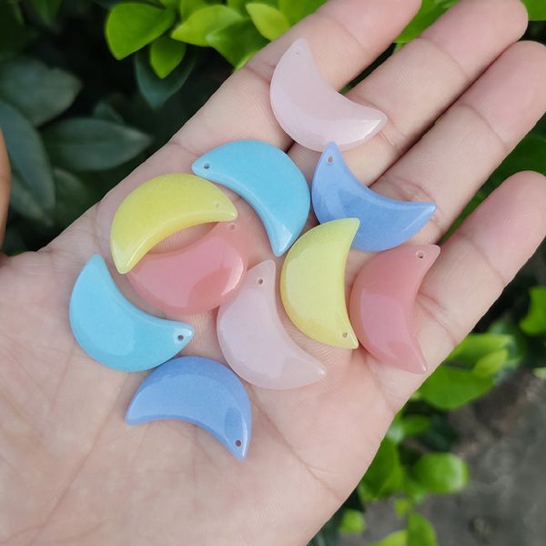 Moon-shaped glowing stone pendant for chakra healing jewelry that shines in darkness