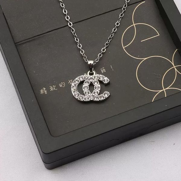 Multi-color luxury earring and necklace set for women featuring double letter crystal pearl and gold clover designs