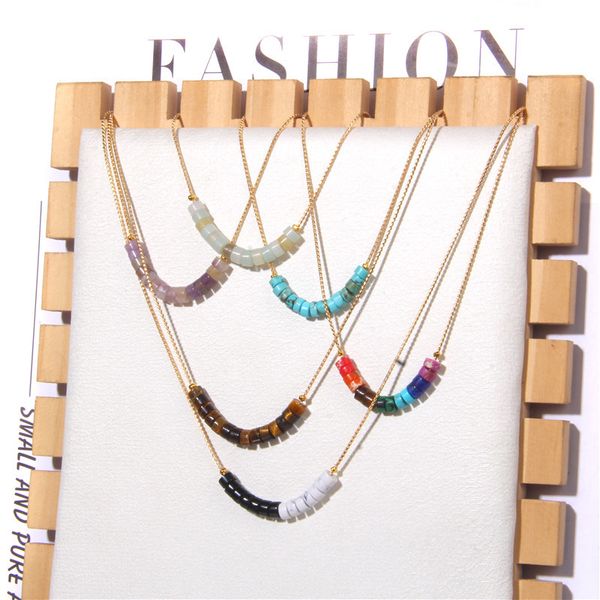 Natural stone necklace featuring Amazonium, Tiger Eye, and Amethyst beads with Senecioserpe spacers on a golden chain, designed as a chakra-inspired jewelry piece for women
