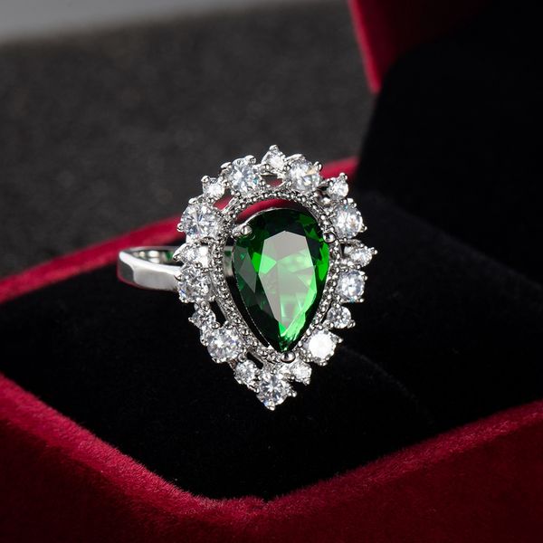 Pear-shaped engagement ring for women in 18k white gold with halo setting, a sparkling jewelry gift