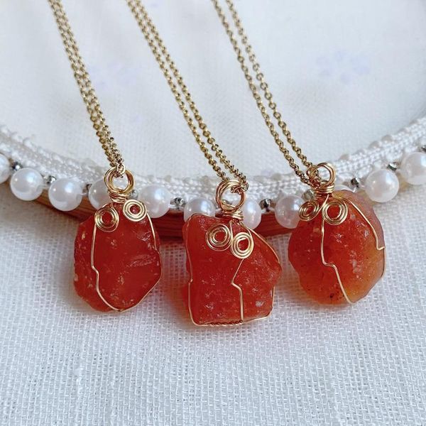 Pendant necklaces featuring 15-20mm natural stone beads on steel chains, wire-wrapped with raw red agate and carnelian crystals for women