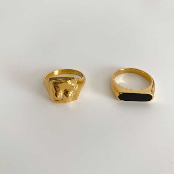 Peri's Box 3 Designs offers black enamel abstract body rings with textured meteorite patterns, featuring irregular vintage titanium steel rings for women, model X0715