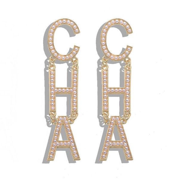 Popular fashion designer's exaggerated large pearl chandelier drop earrings for women in gold and silver