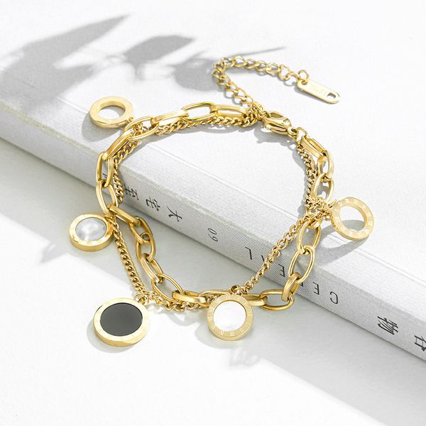 Pretty double-layered openwork stainless steel clover charm bracelet for women, symbolizing luck with its four-leaf design