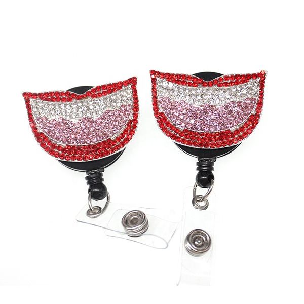 Retractable key ring with pink rhinestone mouth-shaped badge reel and alligator clip for decoration