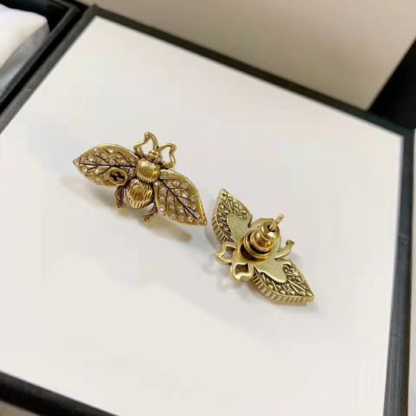 Retro-style designer stud earrings featuring classic G-letter and bee motifs, perfect as women's charm jewelry or wedding gifts