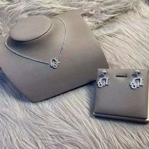 Rhinestone fashion earrings in 925 silver with brass detailing and platinum plating