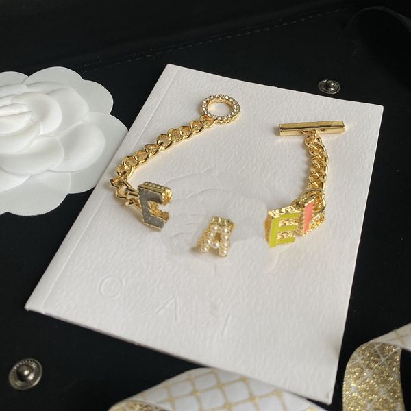 Romantic women's bangle bracelet with designer lettering, crafted in 18K gold-plated stainless steel, perfect as a wedding or lovers' gift