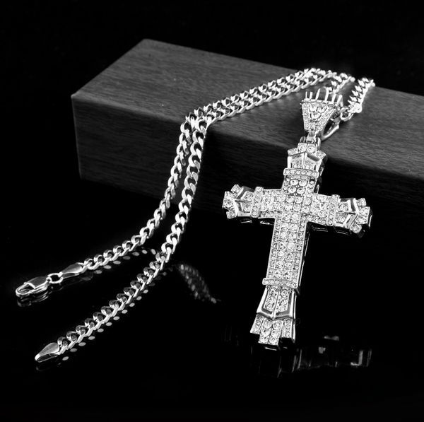 Silver hip hop style cross pendant with full CZ diamond simulation, featuring a Catholic crucifix design on a long Cuban chain necklace