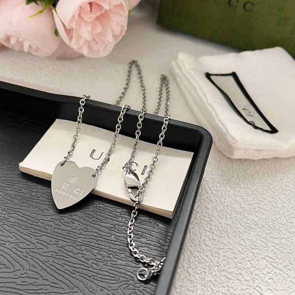 Silver vintage-style necklace and bracelet set for women, featuring heart pendants and long chains as elegant love jewelry gifts