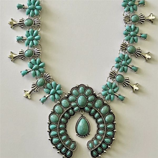 Southwestern-inspired boho necklace featuring a squash blossom design with turquoise and green howlite stones, making a bold tribal statement for cowgirl style