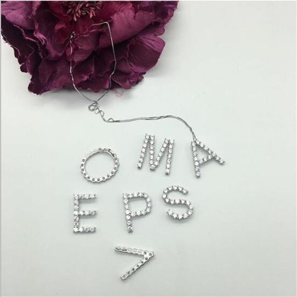 Sparkling crystal-adorned large pendant necklace with letter design, a 2019 trend in 925 sterling silver jewelry
