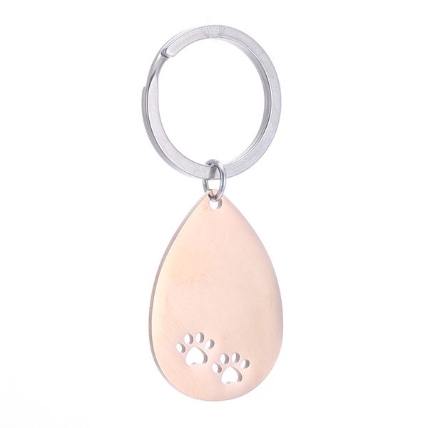Stainless steel customizable dog paw keychains for DIY engraving or printing, featuring a polished mirror pendant and ring accessory