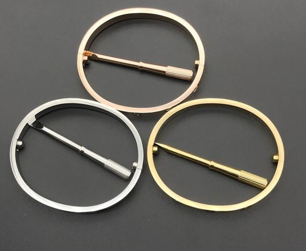 Stainless steel love bracelets in silver and rose gold, featuring screw designs for couples, with a red dustbag included