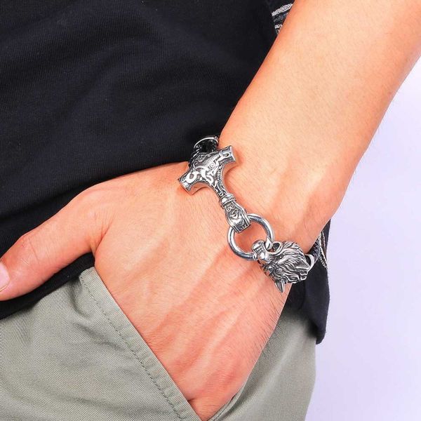 Stainless steel wolf charm bracelet with genuine leather, a stylish men's gift featuring a snap hook bangle
